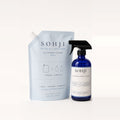 SOHJI All-Purpose Set: All-Purpose Surface Cleaner cobalt glass spray bottle next to its light blue 32 fl oz refill pouch